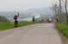 The bunch approaches the summit of Cote de Bonneville with the river Meuse in the valley in the background