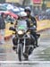 It was a wet day for Jon Devich on the moto  		CREDITS: Rob Jones  		TITLE: Tour of California  		COPYRIGHT: ROB JONES/CANADIAN CYCLIST.COM