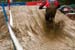 Muddy conditions for downhill qualifiers  		CREDITS: Gary Perkin  		TITLE:   		COPYRIGHT: Copyright � 2010 Gary Perkin. All Rights Reserved. gary@flipper.co.za