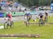 Nash goes up on her front wheel after the first half log obstacle 		CREDITS:  		TITLE: Nove Mesto Na Morave World Cup 		COPYRIGHT: Rob Jones/www.canadiancyclist.com 2011� All rights retained - no copying, printing or other manipulation, editing or process