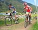 St�phane Tempier (TX Active Bianchi) and  Christoph Sauser (Specialized Racing) 		CREDITS:  		TITLE: World Cup Val di Sole 2011 		COPYRIGHT: Rob Jones/www.canadiancyclist.com 2011� All rights retained - no copying, printing or other manipulation, editing 