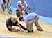 Temporary repairs after the track got chewed up in a crash during qualifying 		CREDITS:  		TITLE: Track World Cup London 		COPYRIGHT: Rob Jones/www.canadiancyclist.com 2012� All rights retained - no use permitted without prior, written permission