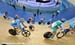 Workers fix the track while the neutralized race goes aroud them 		CREDITS:  		TITLE: Track World Cup London 		COPYRIGHT: Rob Jones/www.canadiancyclist.com 2012� All rights retained - no use permitted without prior, written permission