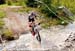 The first half of the lap has two creek crossings 		CREDITS:  		TITLE: 2012 MTB World Championships  		COPYRIGHT: Rob Jones/www.canadiancyclist.com 2012 -copyright -All rights retained - no use permitted without prior, written permission