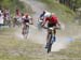Fincham looks to see what sort of a gap he has on Disera as they start the last lap 		CREDITS:  		TITLE: 2018 MTB XC Championships - Team Relay 		COPYRIGHT: Rob Jones/www.canadiancyclist.com 2018 -copyright -All rights retained - no use permitted without 
